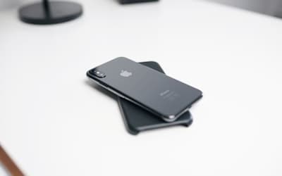 Space gray iPhone X on white surface