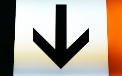 A close up of a sign with an arrow