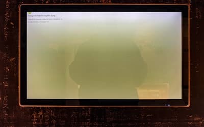 A computer screen shows a hazy green display