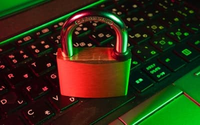 Red padlock on black computer keyboard