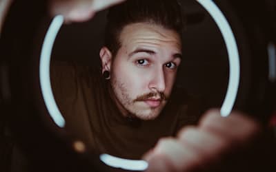 Man in black shirt holding white light